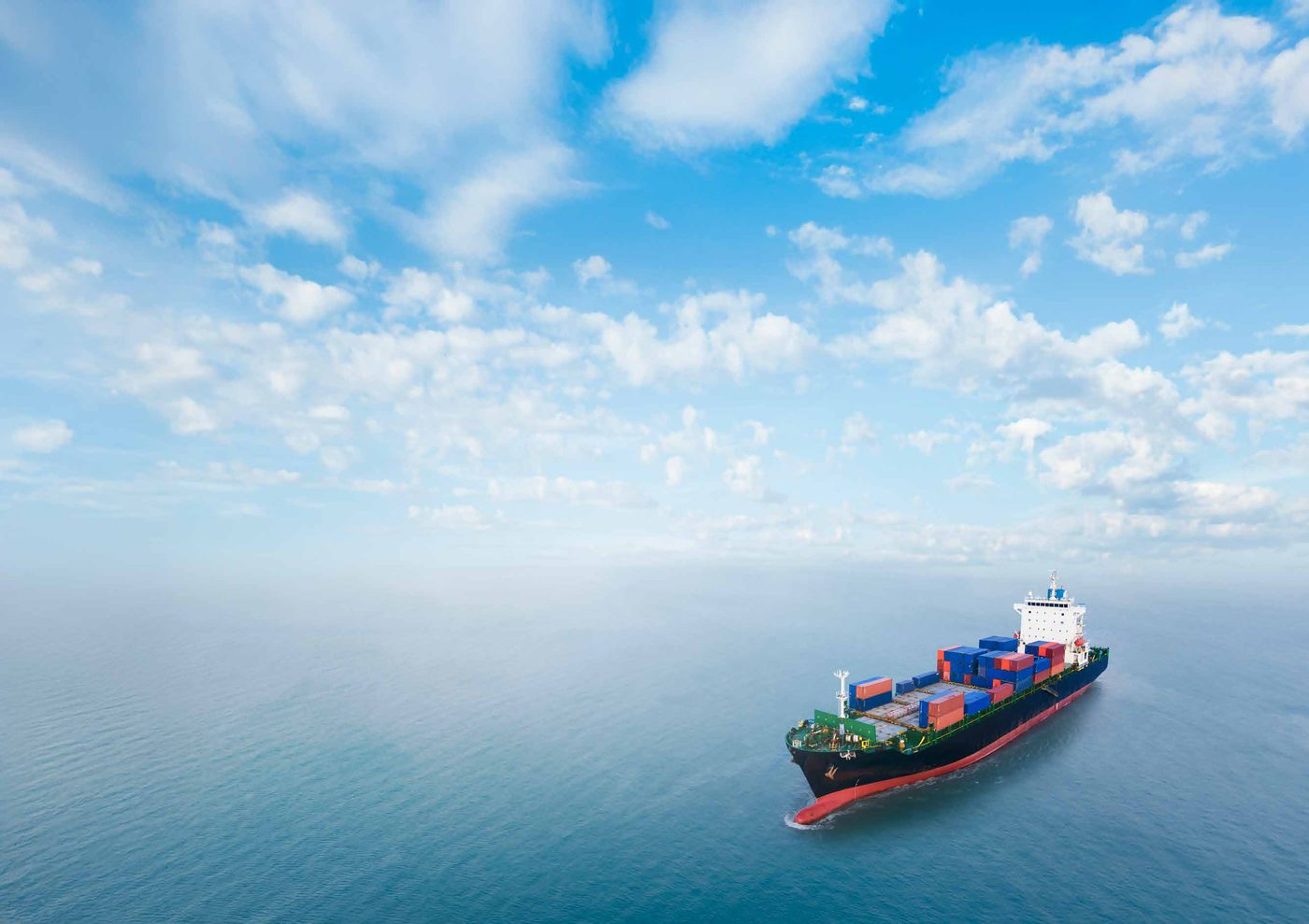 A container ship sailing across open ocean